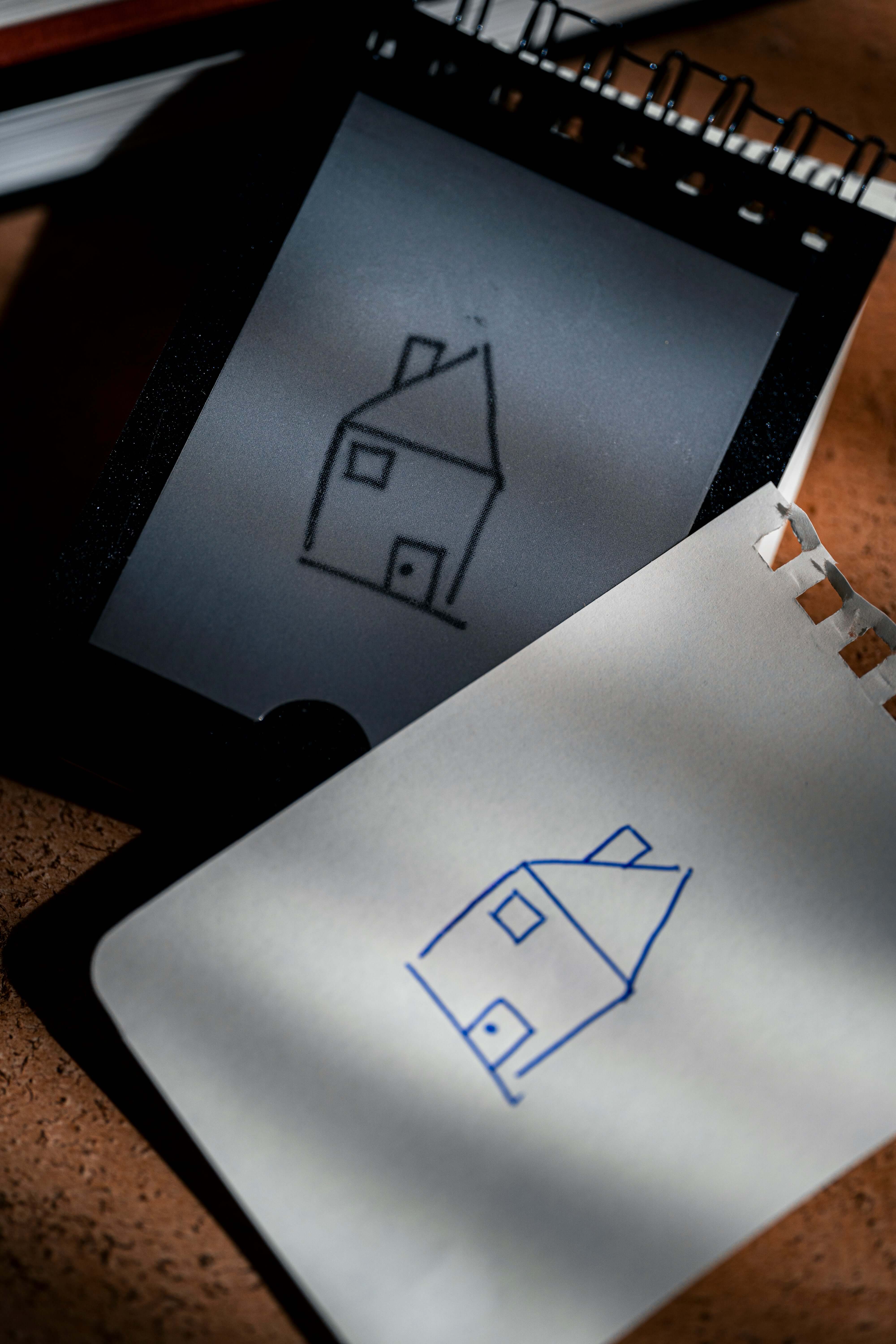 REPLICA: Pocket-size Impression Pad showcasing a sketch of a house in a notepad.
