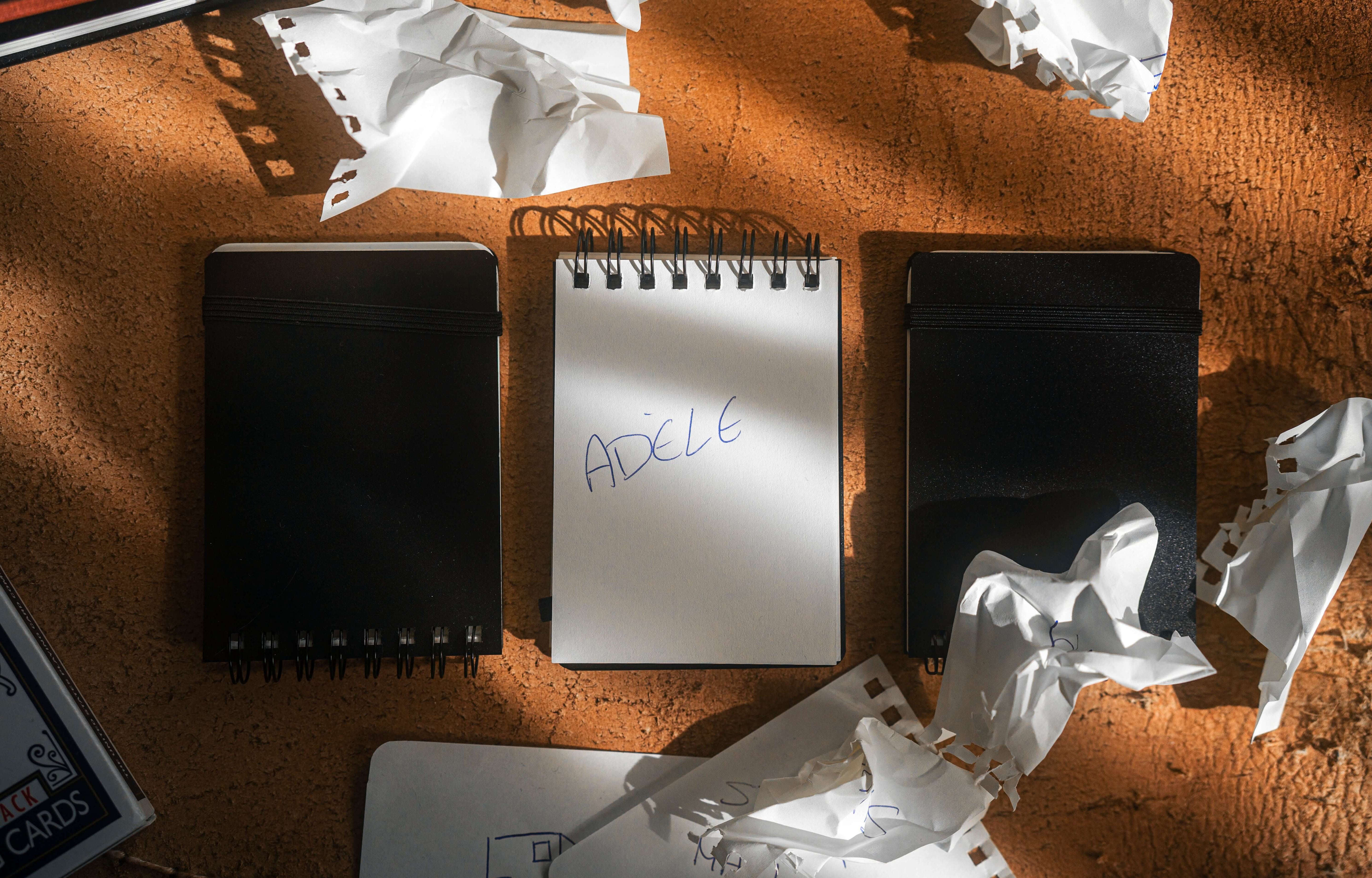 REPLICA: Pocket-size Impression Pad with a notepad and crumpled paper around it.